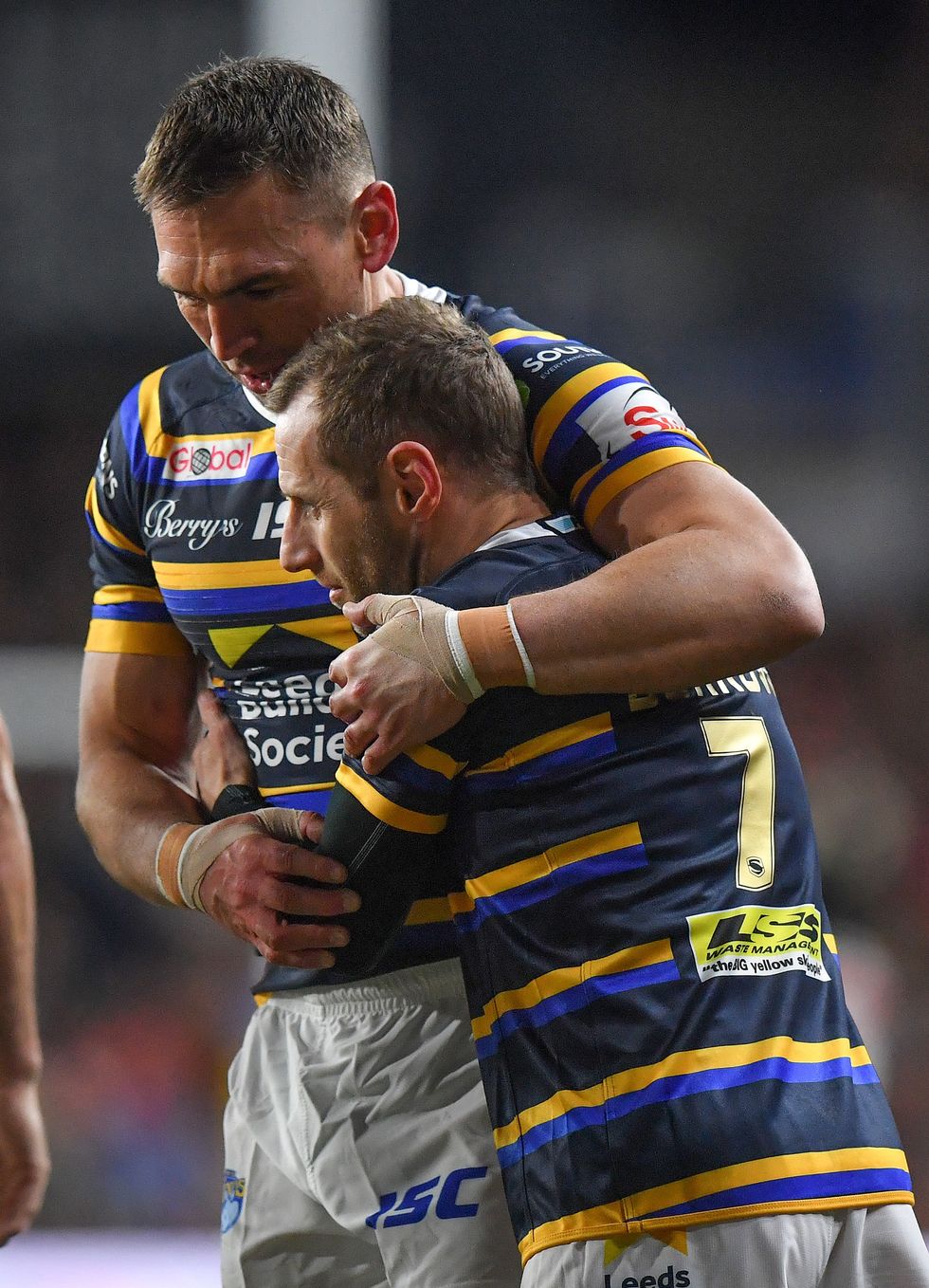 Kevin Sinfield (left) hugs Rob Burrow after the testimonial match at Emerald Headingley