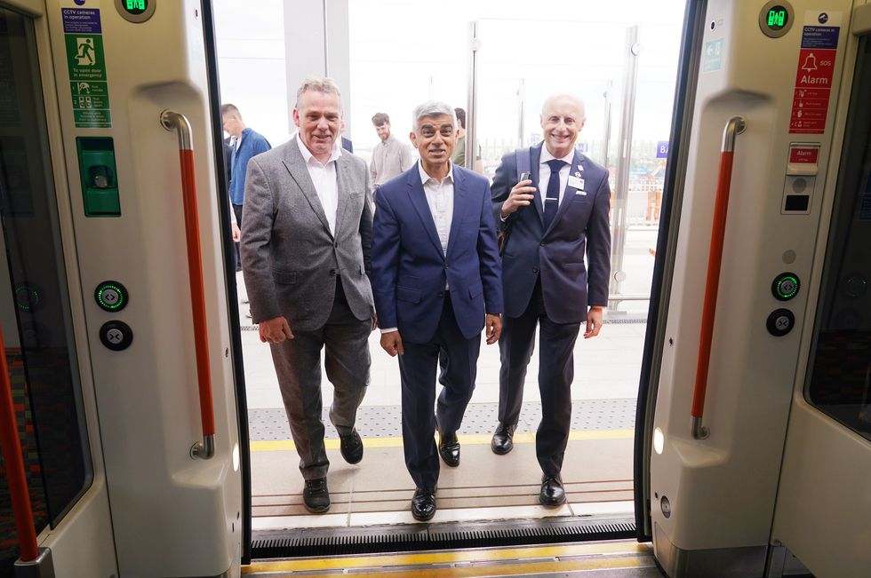 Khan boarding Overground train
