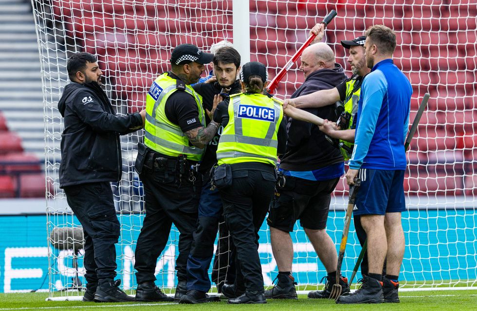 Kick off was delayed as the man was removed from the goal post