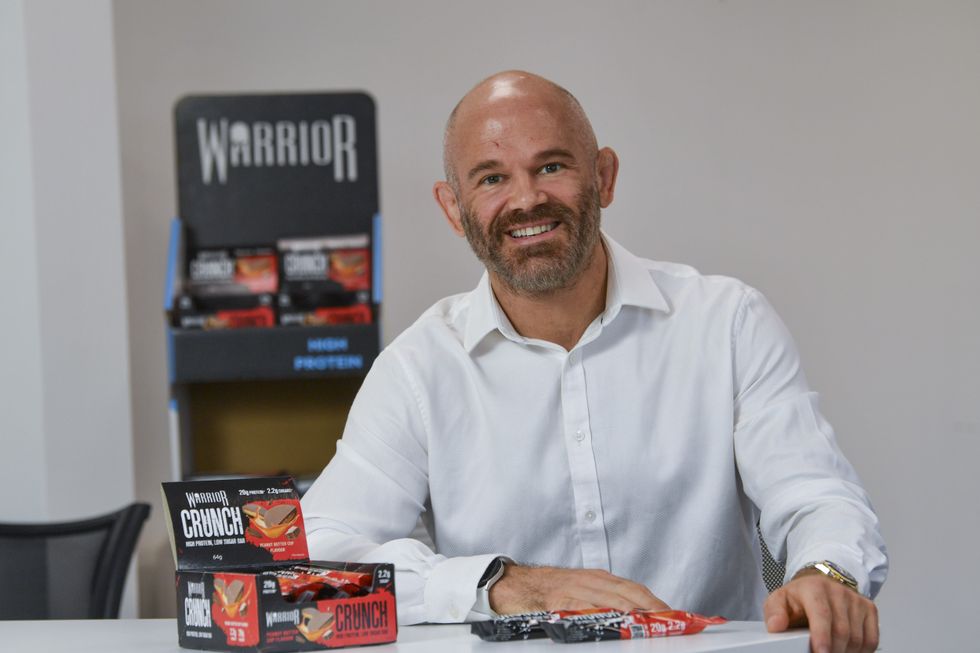 Kieran Fisher with Warrior products