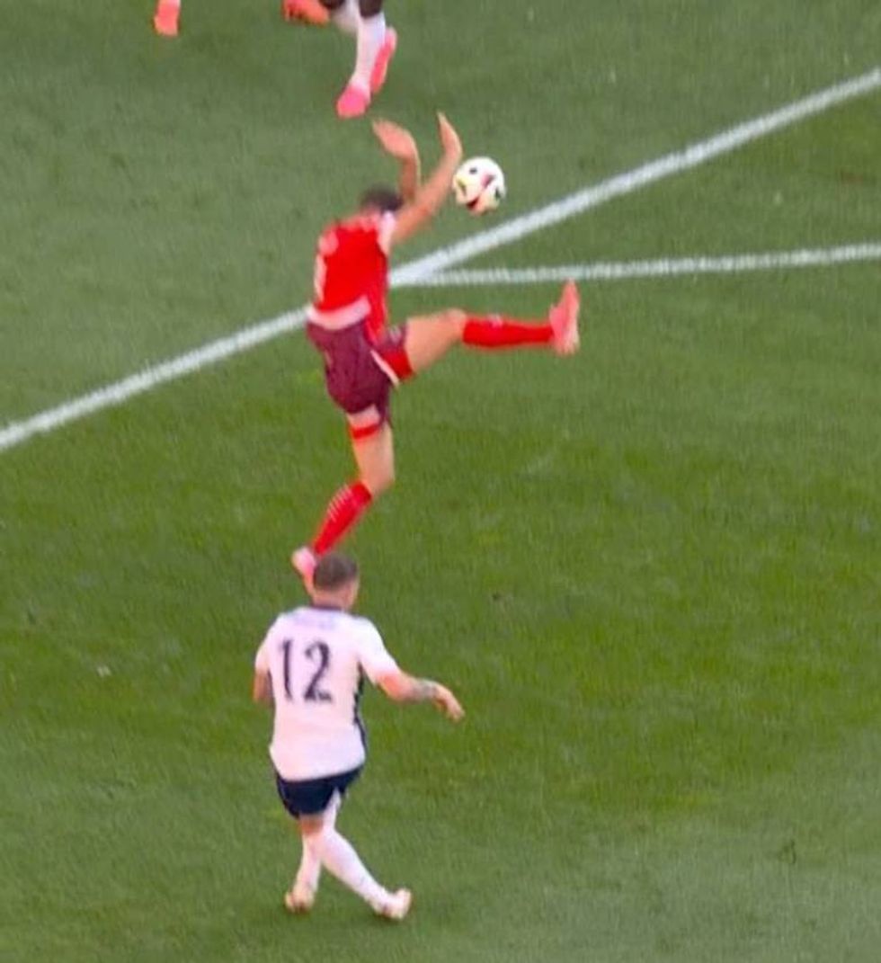 Kieran Trippier's cross was blocked by the hands of the Swiss player