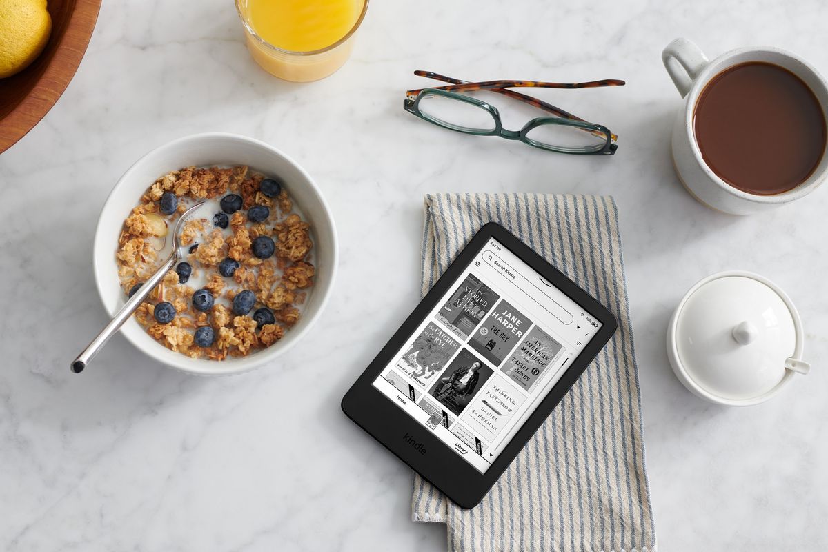 Kindle pictured on a breakfast table with cereal and coffee