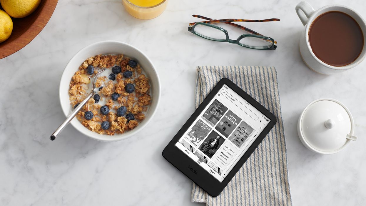 Kindle pictured on a breakfast table with cereal and coffee