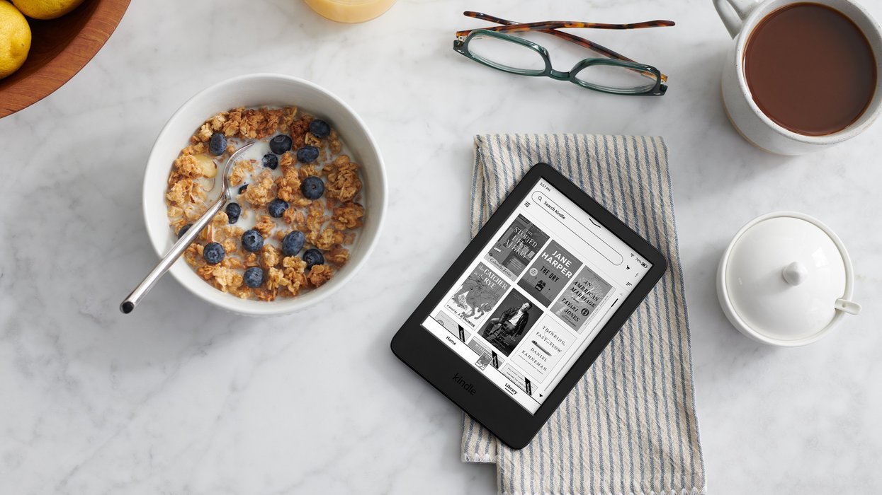 Kindle pictured on a breakfast table with cereal and coffee