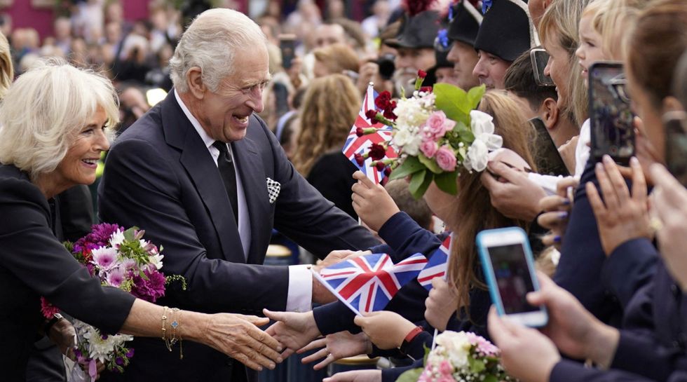 King Charles and Queen Consort greet crowds