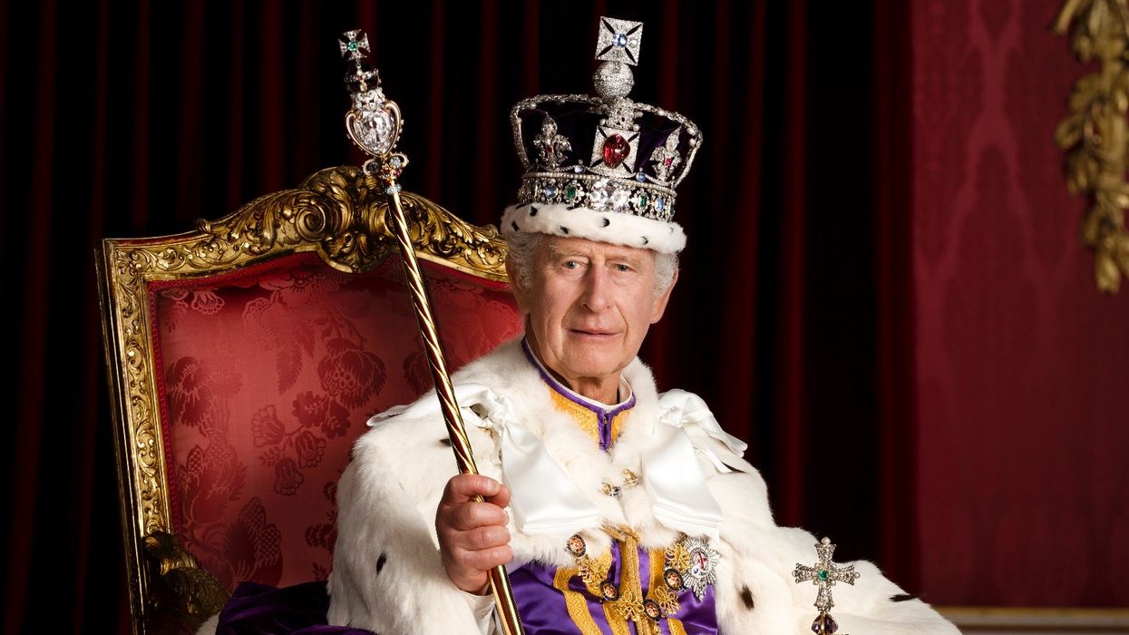King Charles donned his crown and regalia for an individual snap in Buckingham Palace’s Throne Room