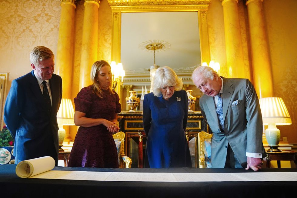 King Charles III and Queen Camilla are presented with the Coronation Roll