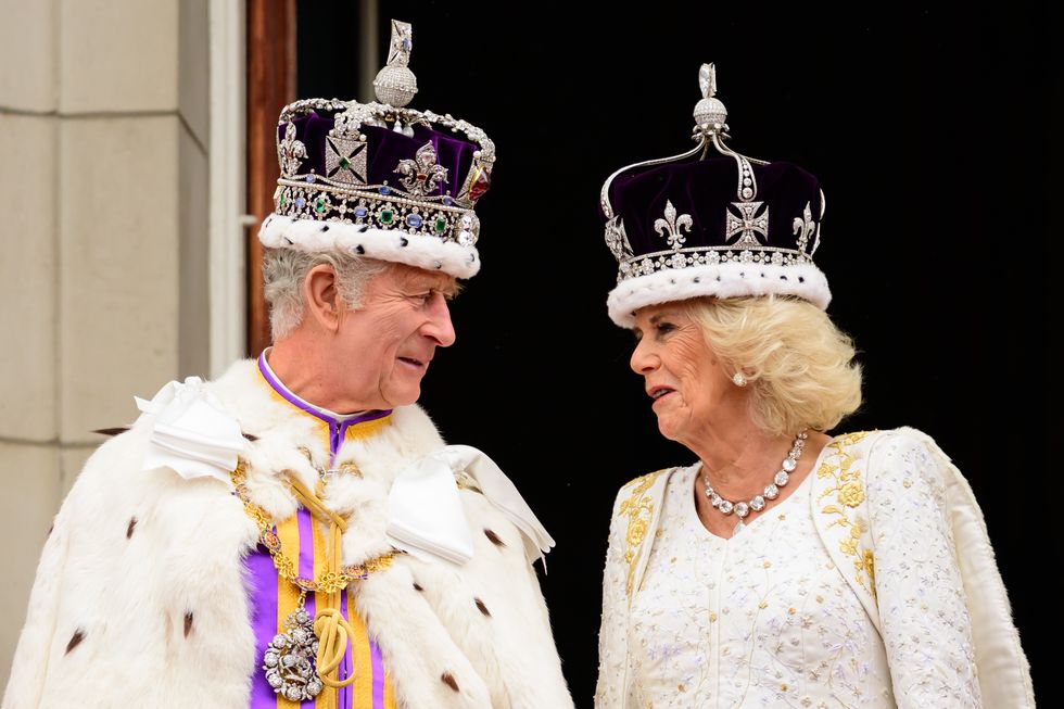 King Charles III and Queen Camilla on the balcony of Buckingham Palace following the Coronation ceremony
