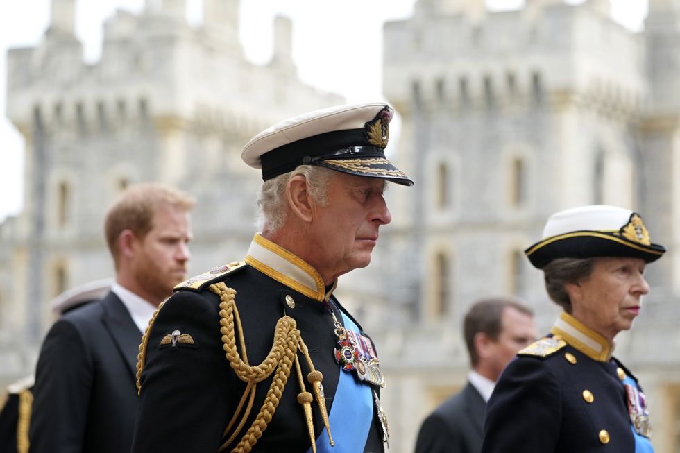 King Charles III and the Princess Royal follow the coffin of Queen Elizabeth II as it arrives at Windsor Castle for the Committal Service at St George's Chapel.