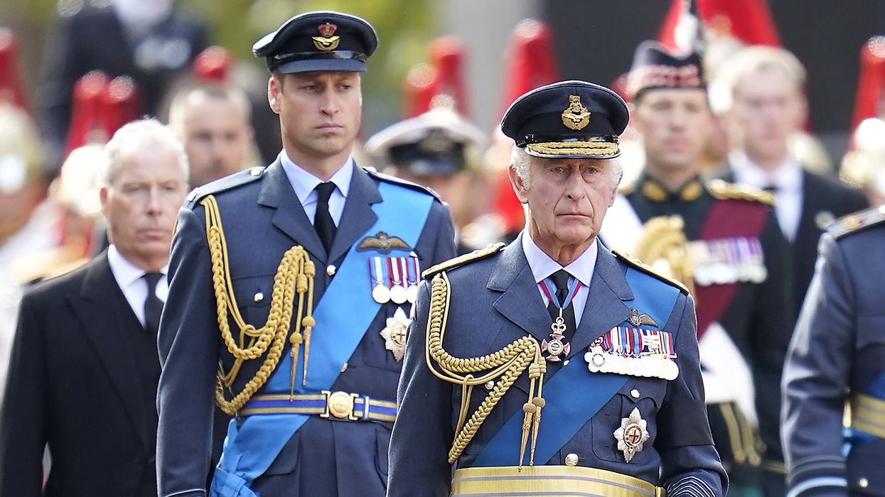 King Charles III (centre) and the Prince of Wales walks behind the coffin of Queen Elizabeth II