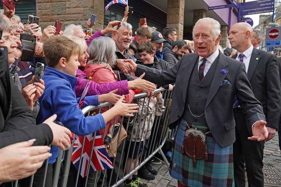 King Charles III greets members of the public as he arrives at an official council meeting at the City Chambers in Dunfermline, Fife, to formally mark the conferral of city status on the former town, ahead of a visit to Dunfermline Abbey to mark its 950th anniversary. Picture date: Monday October 3, 2022.