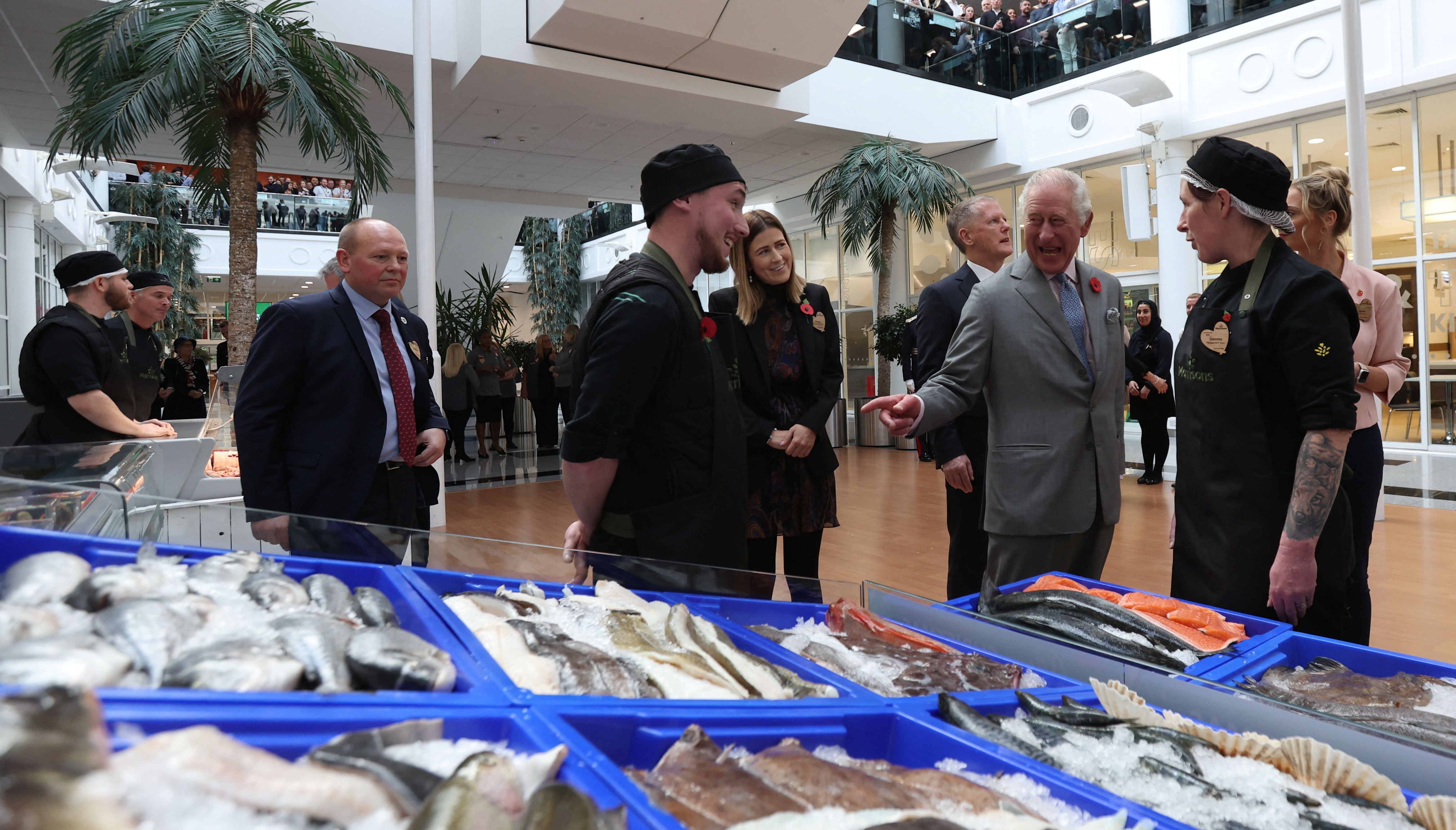 King Charles III meets members of staff during a visit to the head office of Morrisons in Bradford.