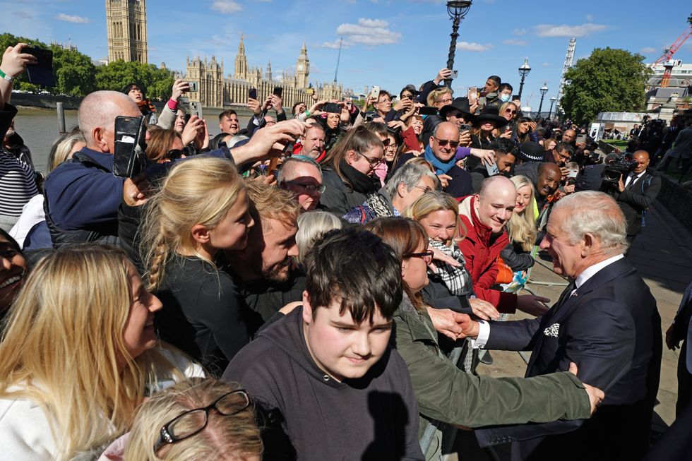 King Charles III meets members of the public in the queue along the South Bank, near to Lambeth Bridge, London, as they wait to view Queen Elizabeth II lying in state ahead of her funeral on Monday. Picture date: Saturday September 17, 2022.