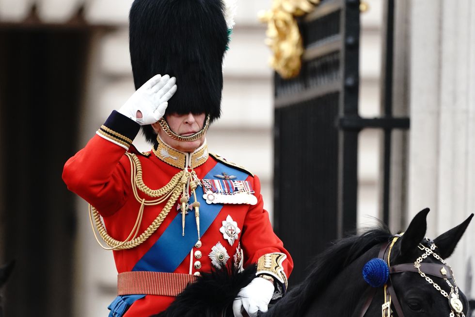 King Charles III saluting as he departed Buckingham Palace for the Trooping the Colour ceremony at Horse Guards Parade