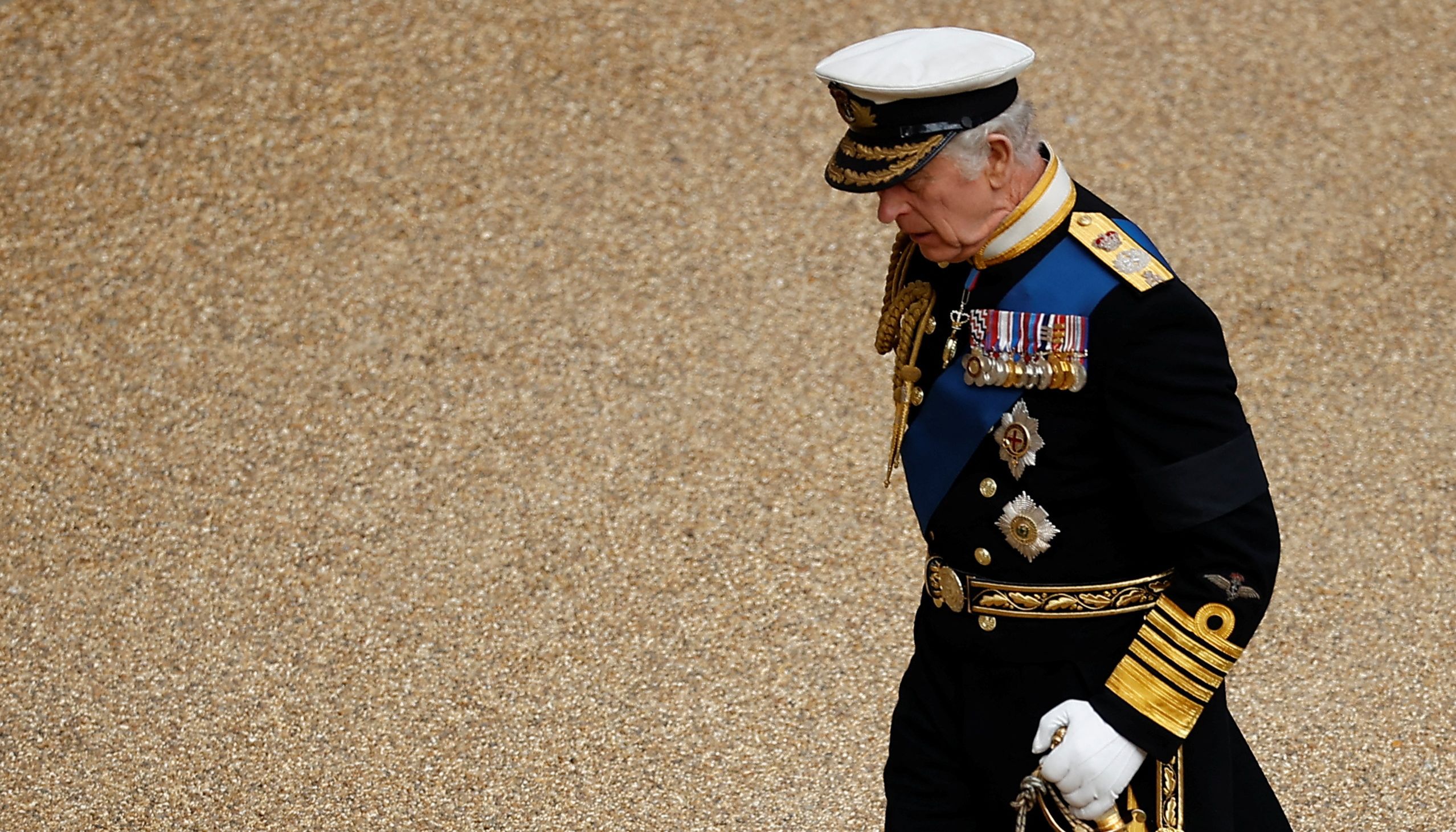 King Charles III walks through Windsor Castle ahead of a Committal Service at St George's Chapel for Queen Elizabeth II.