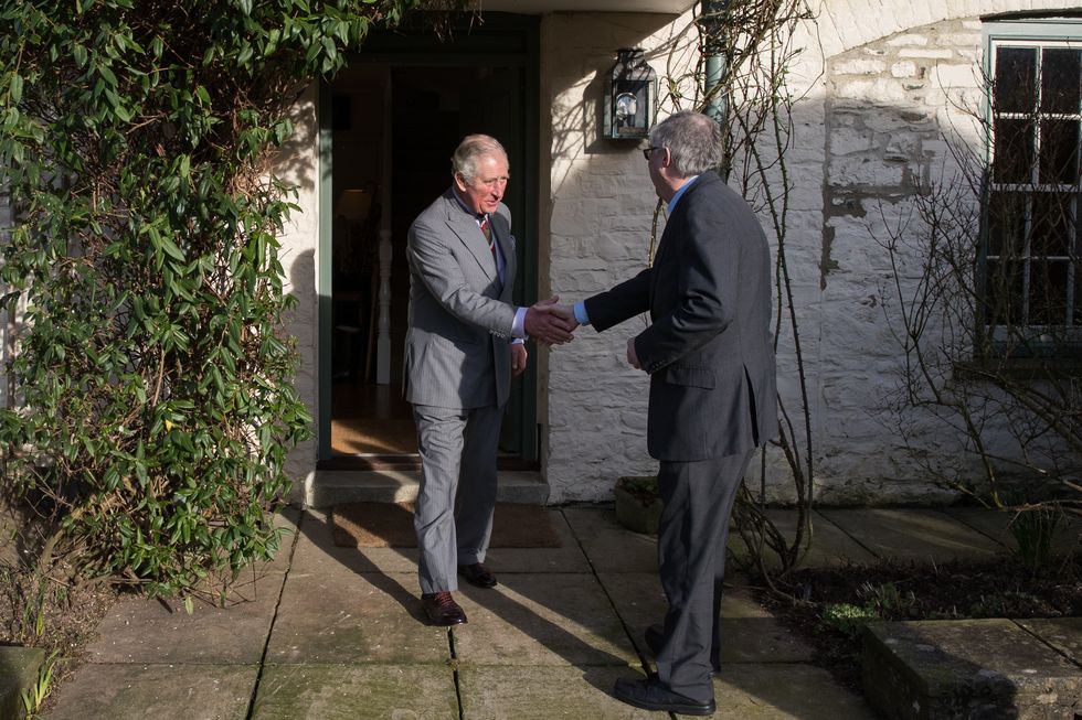 King Charles (left) meets the new First Minister for Wales Mark Drakeford for the first time at Llwynywermod in Llandovery.