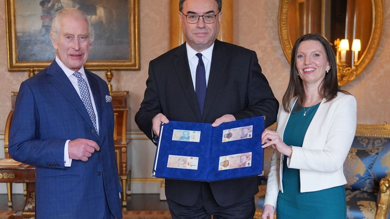 King Charles presented with bank notes