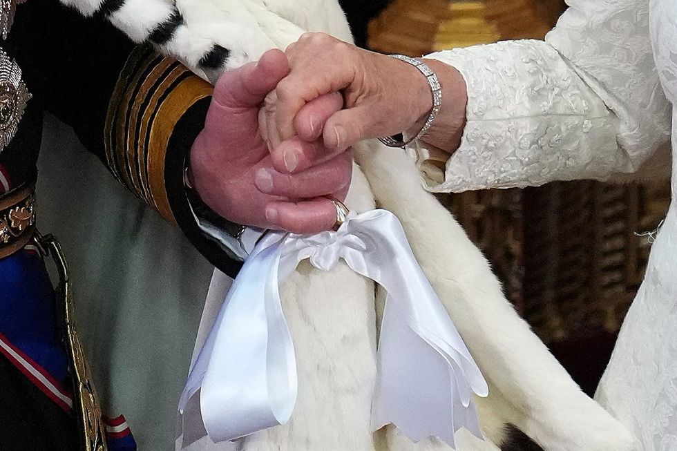 King Charles Queen Camilla holding hands