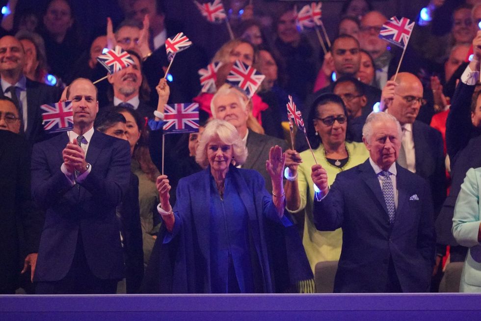King Charles (right), Queen Camilla (centre) and Prince William (left) enjoying the Coronation concert yesterday