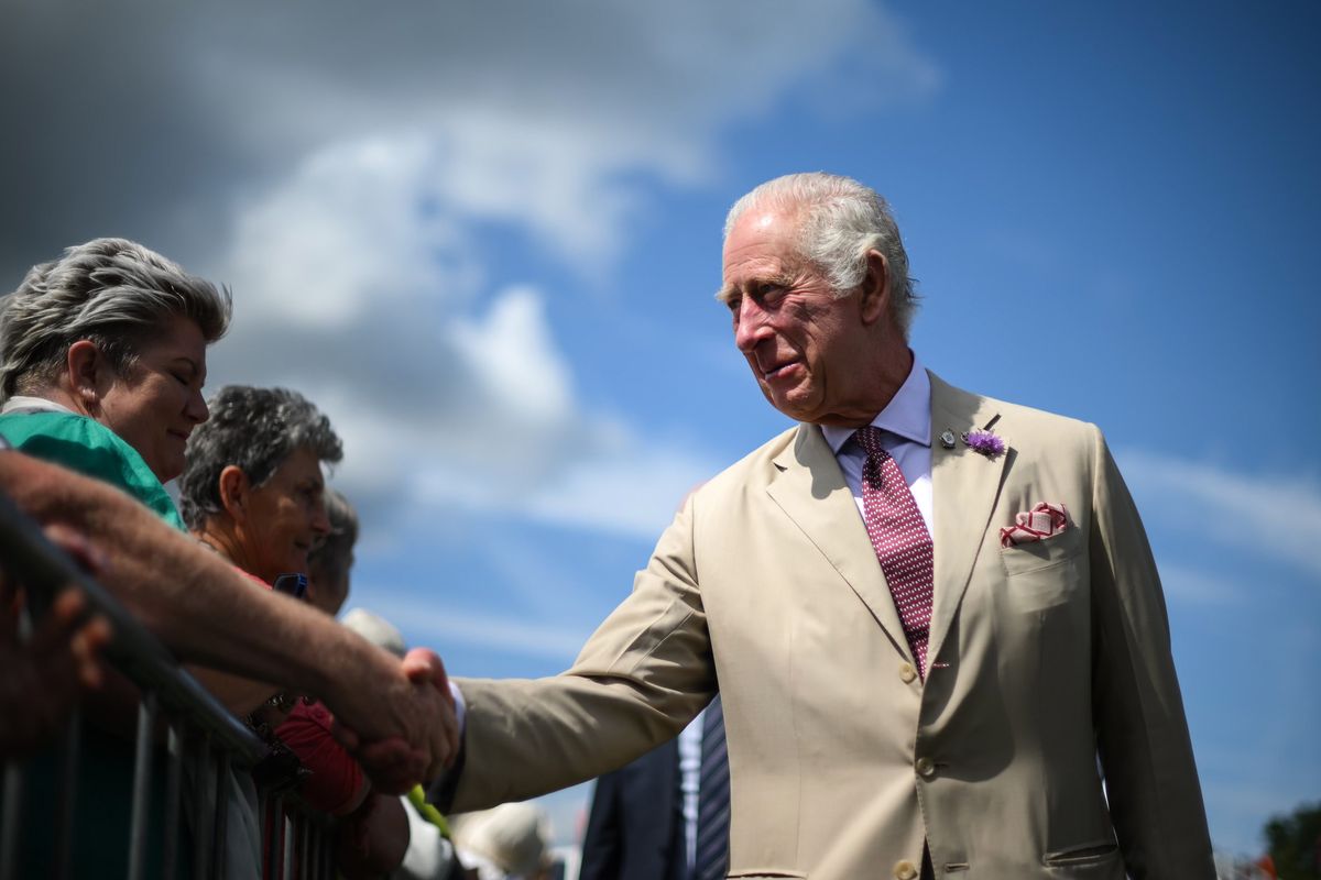 King Charles shakes hands with royal fans