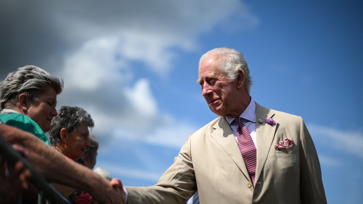 King Charles shakes hands with royal fans