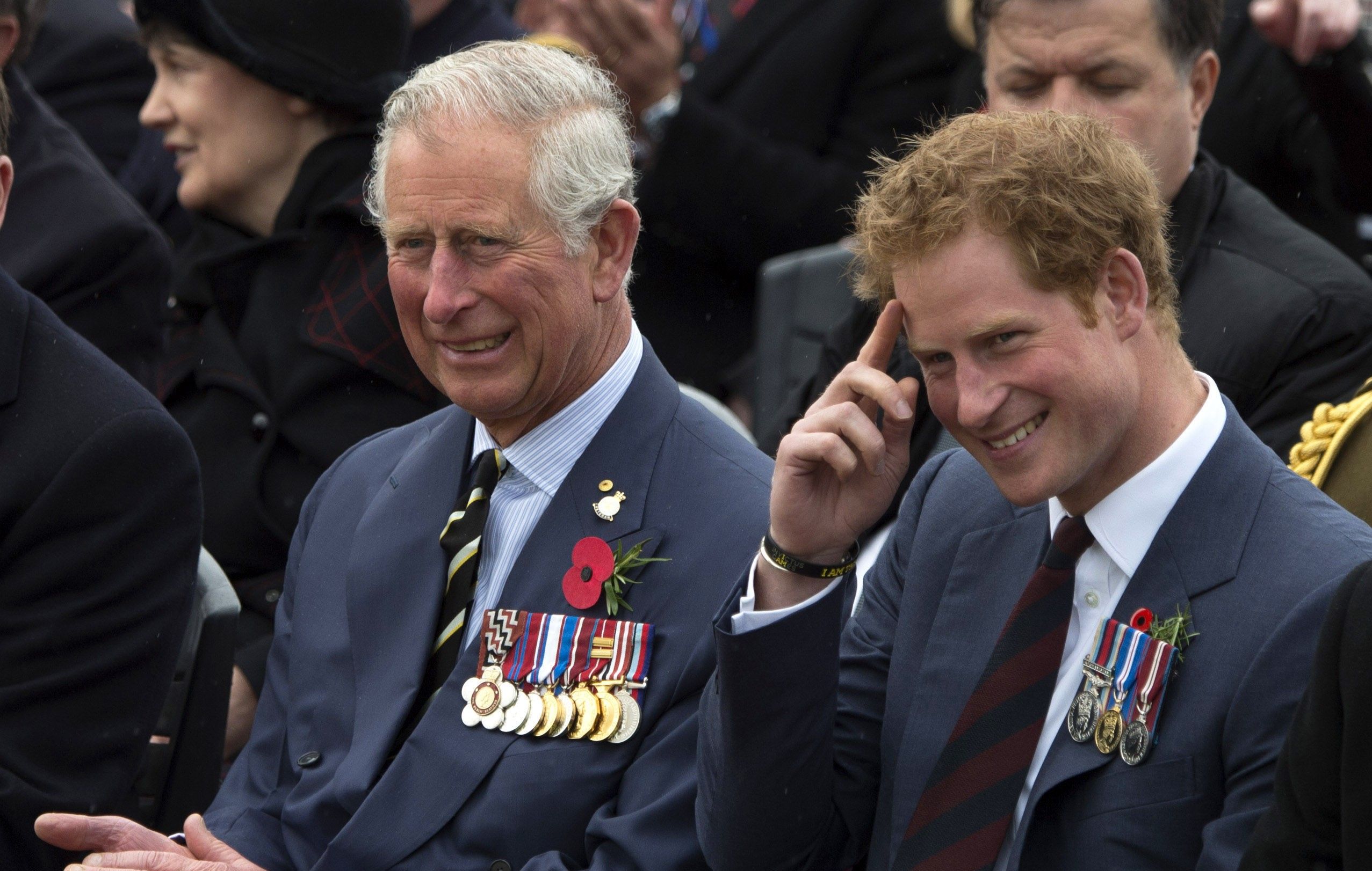 King Charles sitting next to Prince Harry