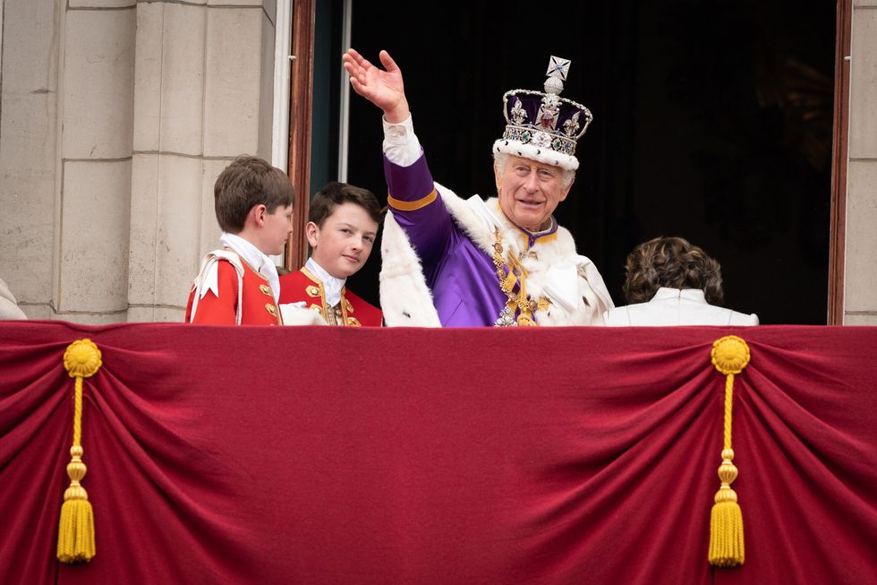 King Charles waves to crowds on the Buckingham Palace balcony
