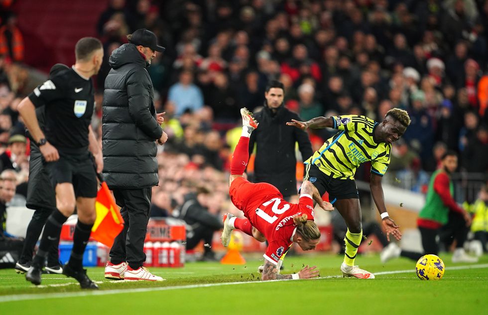 Kostas Tsimikas landed awkwardly on his shoulder