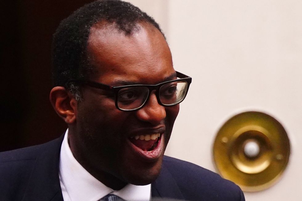 Kwasi Kwarteng leaves 11 Downing Street after he accepted Prime Minister Liz Truss' request he \%22stand aside\%22 as Chancellor