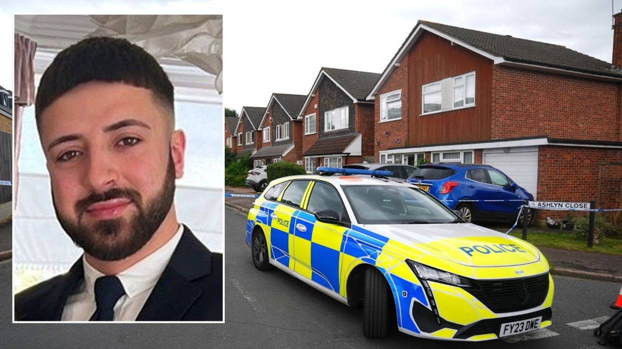 Kyle Clifford with a police car outside the Hunt's Hertfordshire home