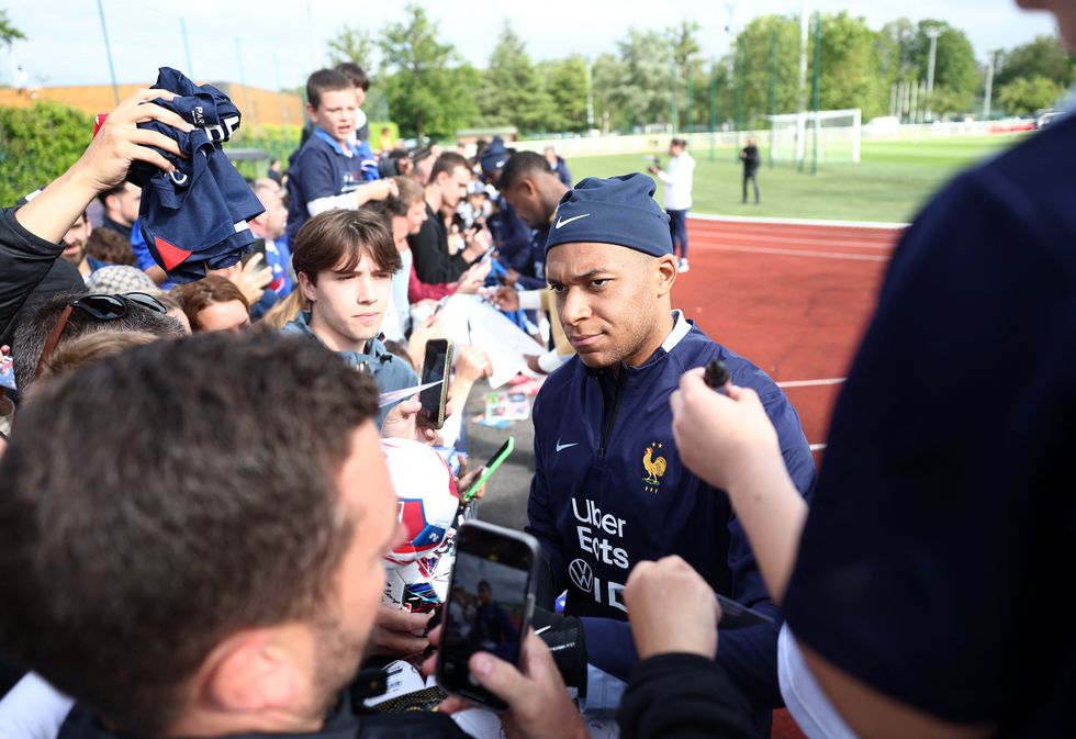 Kylian Mbappe has already been signing Real Madrid shirts