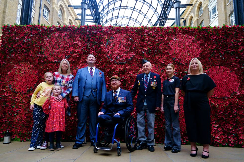 (L-R) Afghanistan Veteran Sally Renard with her daughters Daisy and Maya, Army Veteran Clive Jones, Afghanistan Veteran Anthony Cooper, 98-year-old D-Day Veteran Bernard Morgan.