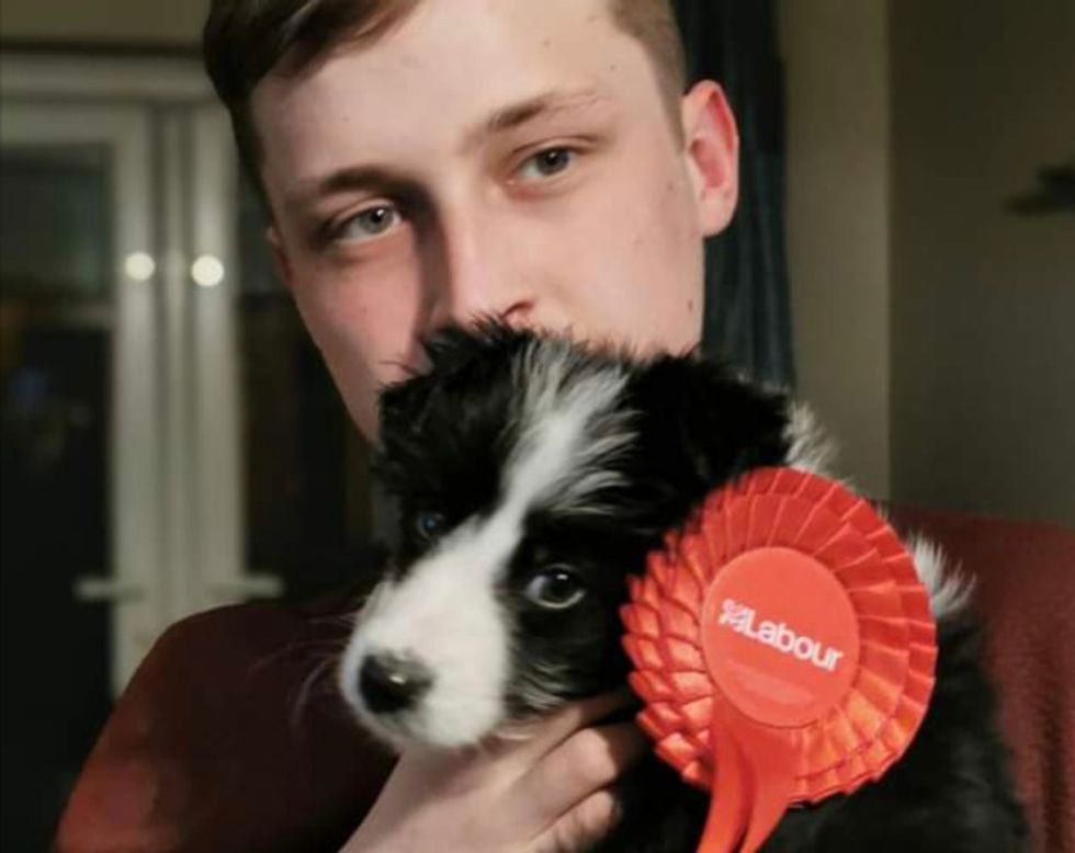Labour Council candidate Robson Augusta holds his Border Collie