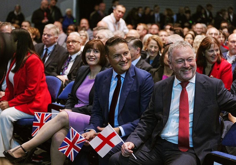 Labour Ministers were spotted clutching Union Jacks and St George's flags