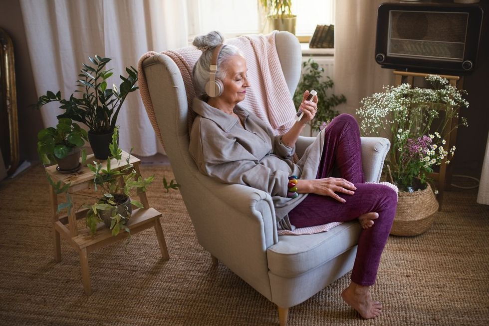 LADY LISTENING TO MUSIC