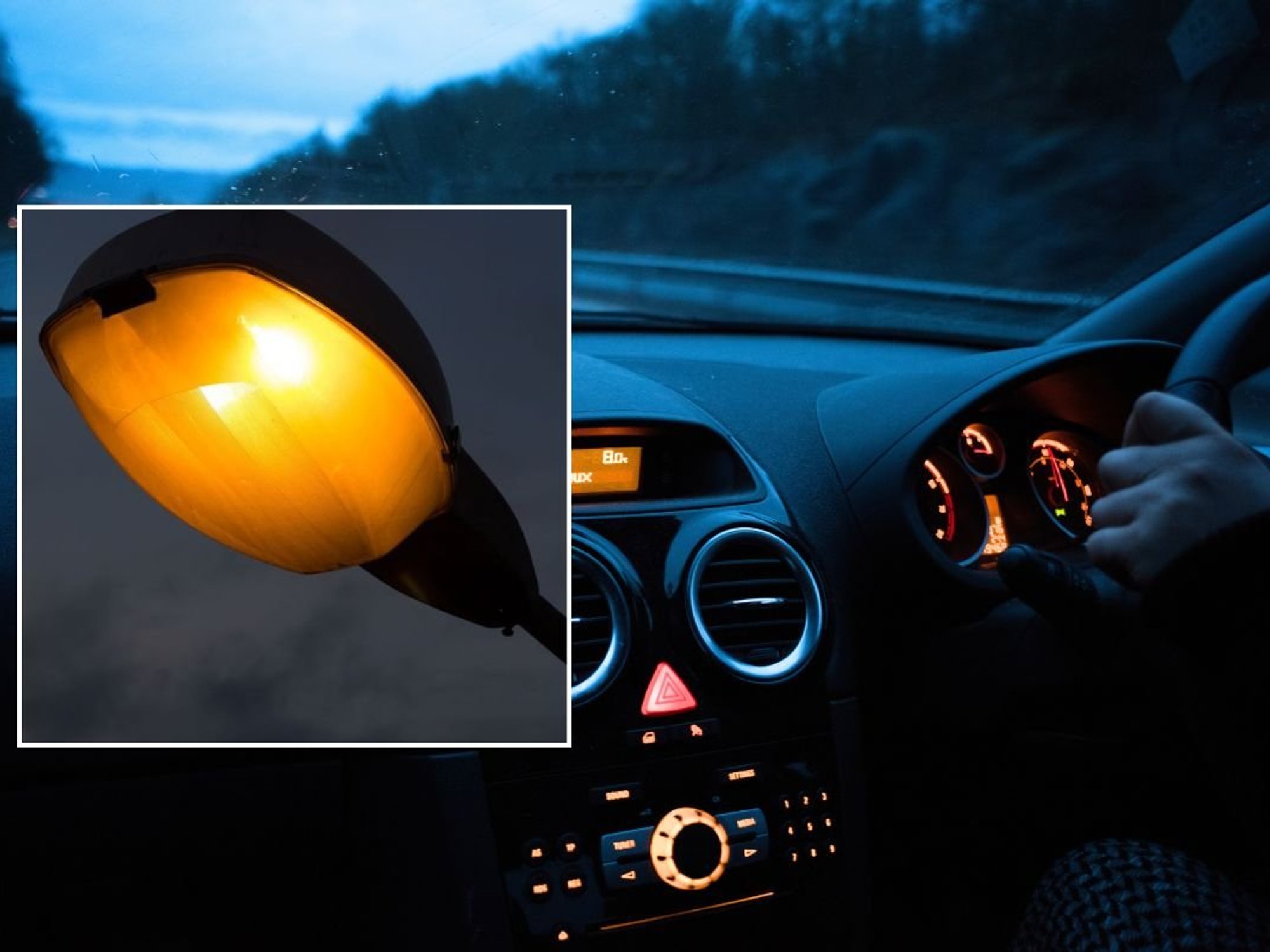 Lamppost and a man driving a car at night
