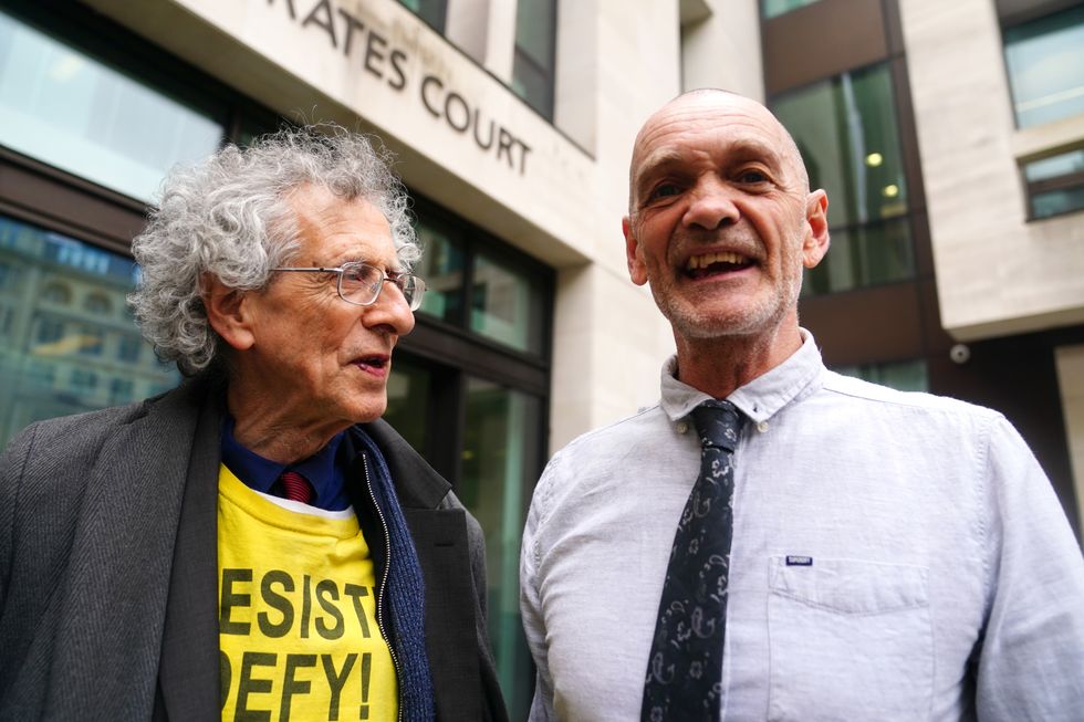Lance O'Connor with Piers Corbyn outside Westminster Magistrates' Court, London, where Mr O'Connor is appearing on charges of harassing MP Peter Kyle in Parliament Square on October 20 last year. Picture date: Tuesday May 3, 2022.