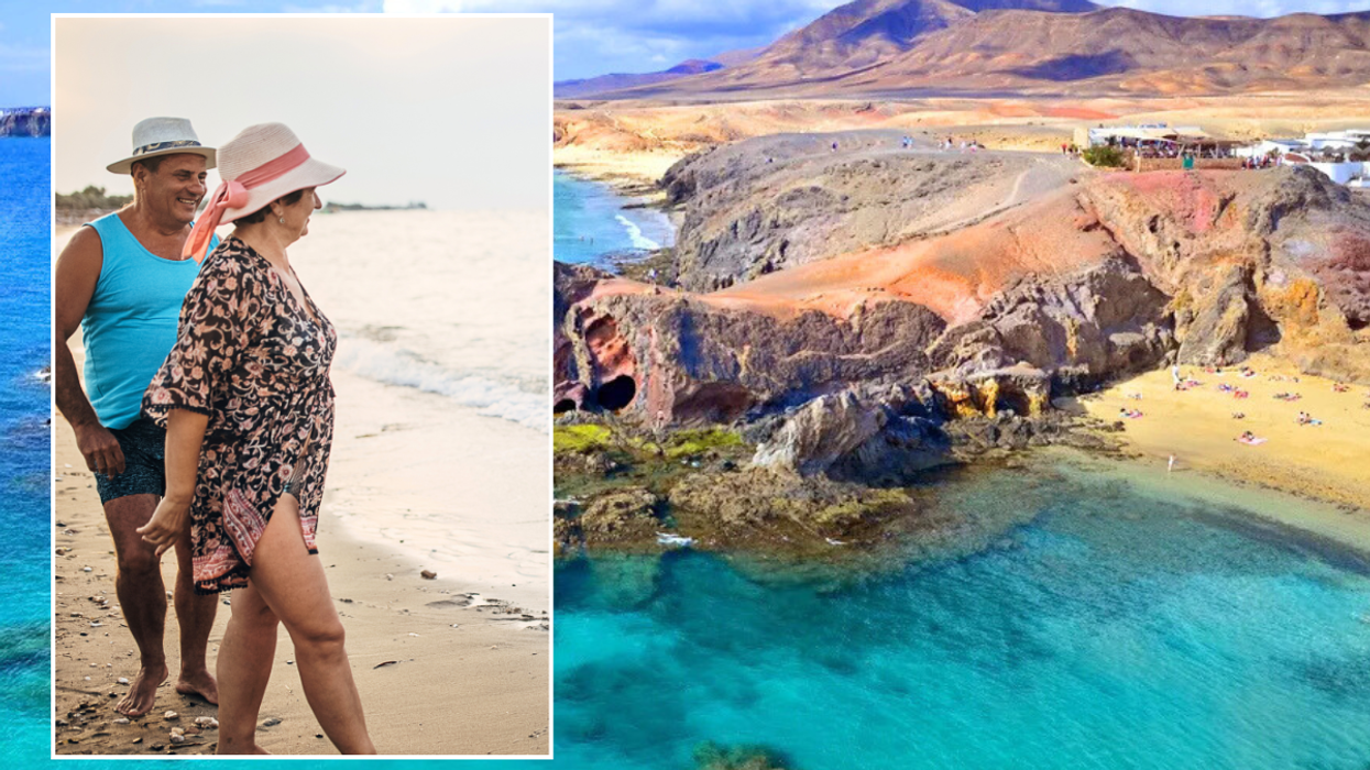 Lanzarote sea / middle aged couple on beach