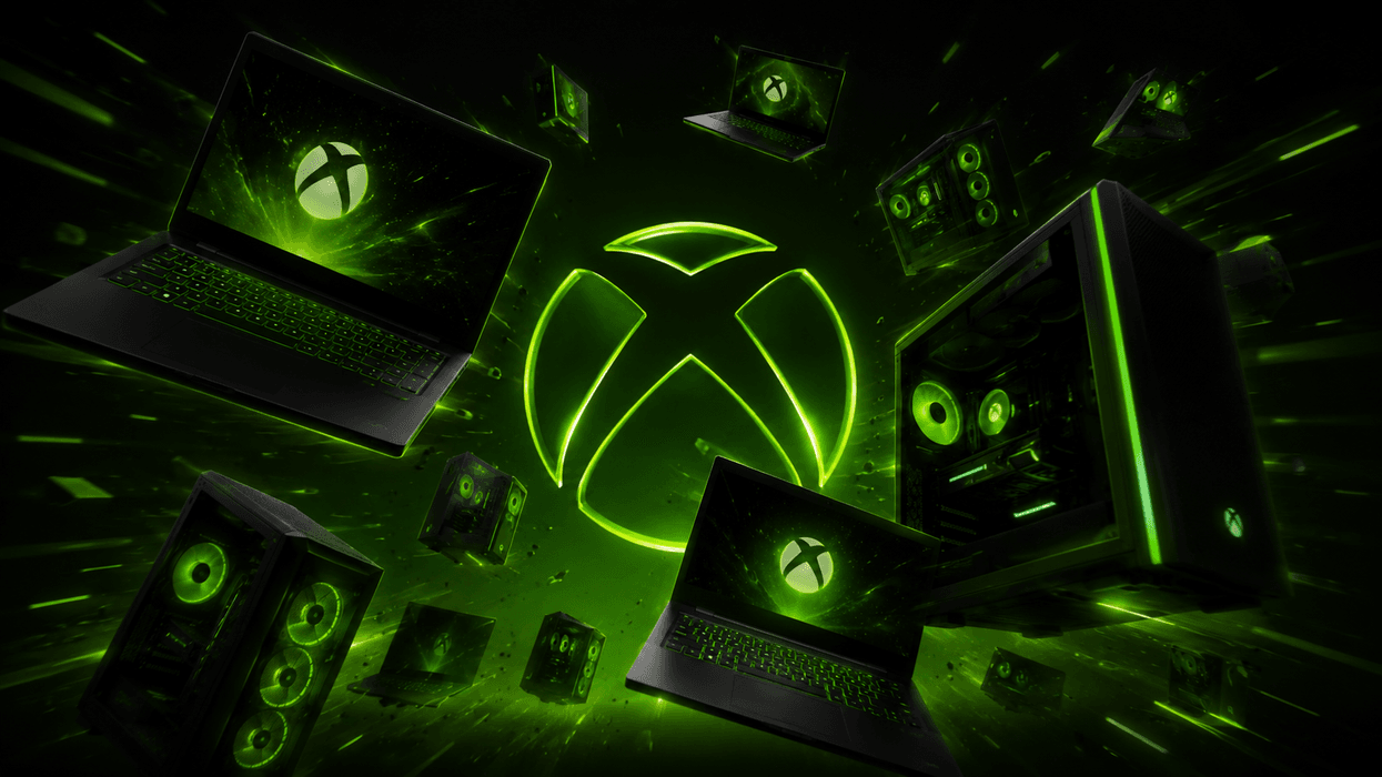 laptop and desktop PCs pictured flying towards the camera with the green xbox logo in the background