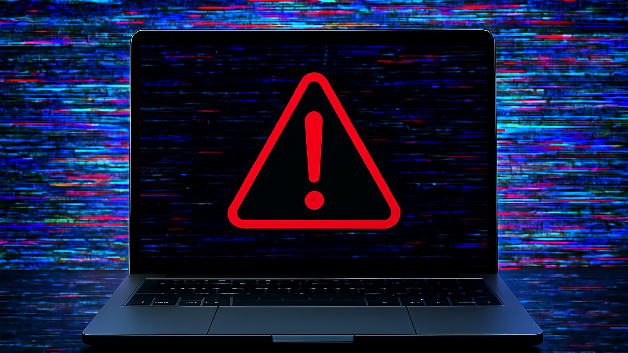 laptop with red warning sign