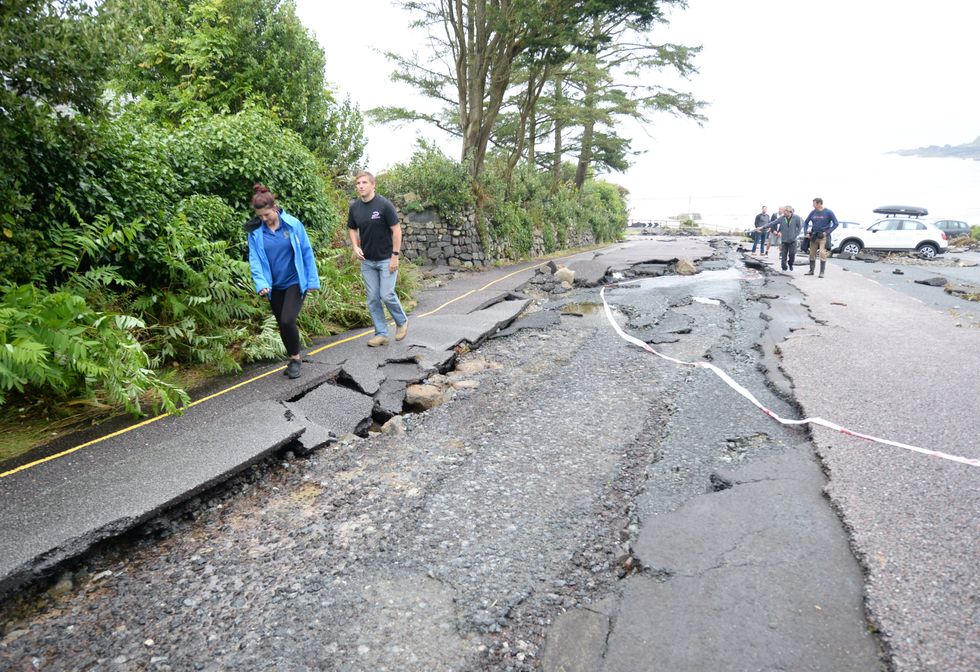 Large damage in road caused by poor weather