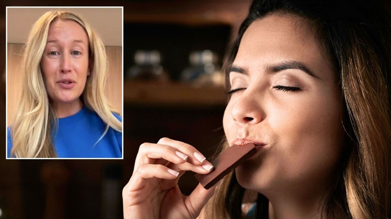 Lauren Hubert / Woman eating dark chocolate