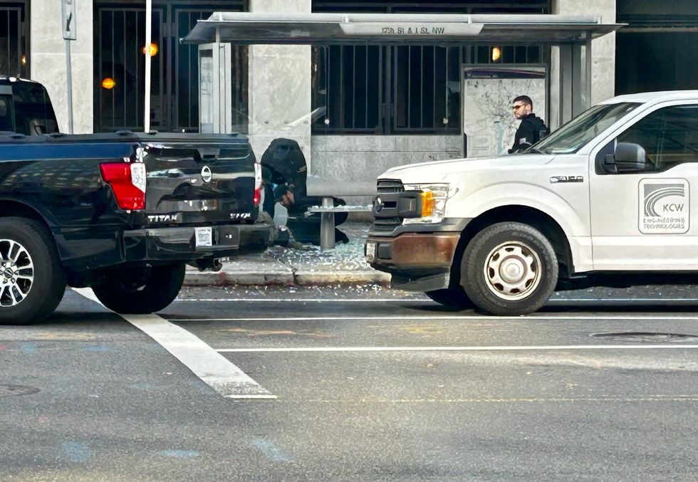 Law enforcement respond at the scene after two National Guard members were shot near the White House in Washington DC