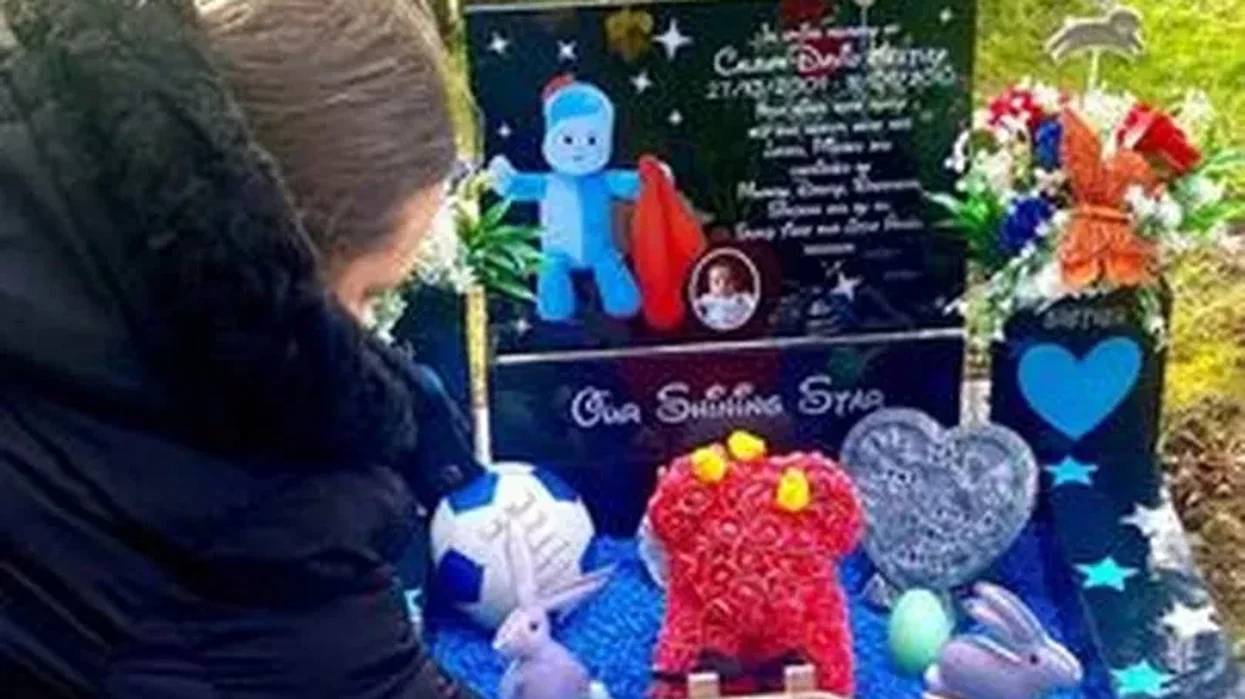 Leanne Thompson at the grave of her son