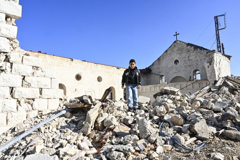 Lebanese Christian boy in ruins of church