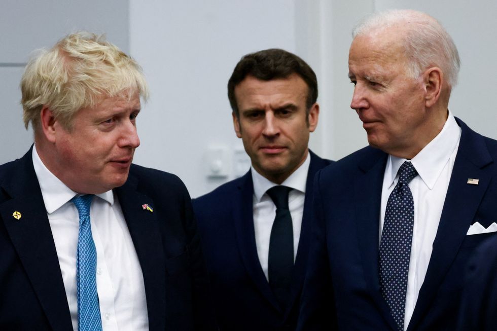 (Left-right) Prime Minister Boris Johnson, France's President Emmanuel Macron and U.S. President Joe Biden arrive for a G7 leaders meeting during a NATO summit on Russia's invasion of Ukraine, at the alliance's headquarters in Brussels, Belgium. Picture date: Thursday March 24, 2022.
