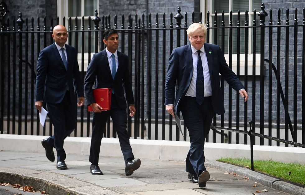 (left to right) Health Secretary Sajid Javid, Chancellor of the Exchequer Rishi Sunak and Prime Minister Boris Johnson arriving at No 9 Downing Street for a media briefing on the long-awaited plan to fix the broken social care system.