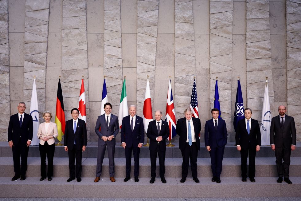 (left to right) Nato Secretary General Jens Stoltenberg, European Commission President Ursula von der Leyen, Japan's Prime Minister Fumio Kishida, Canada's Prime Minister Justin Trudeau, U.S. President Joe Biden, Germany's Chancellor Olaf Scholz, British Prime Minister Boris Johnson, France's President Emmanuel Macron, Italy's Prime Minister Mario Draghi and European Council President Charles Michel pose for a G7 leaders' family photo during a Nato summit in Brussels, Belgium to discuss Russia's invasion of Ukraine. Picture date: Thursday March 24, 2022.