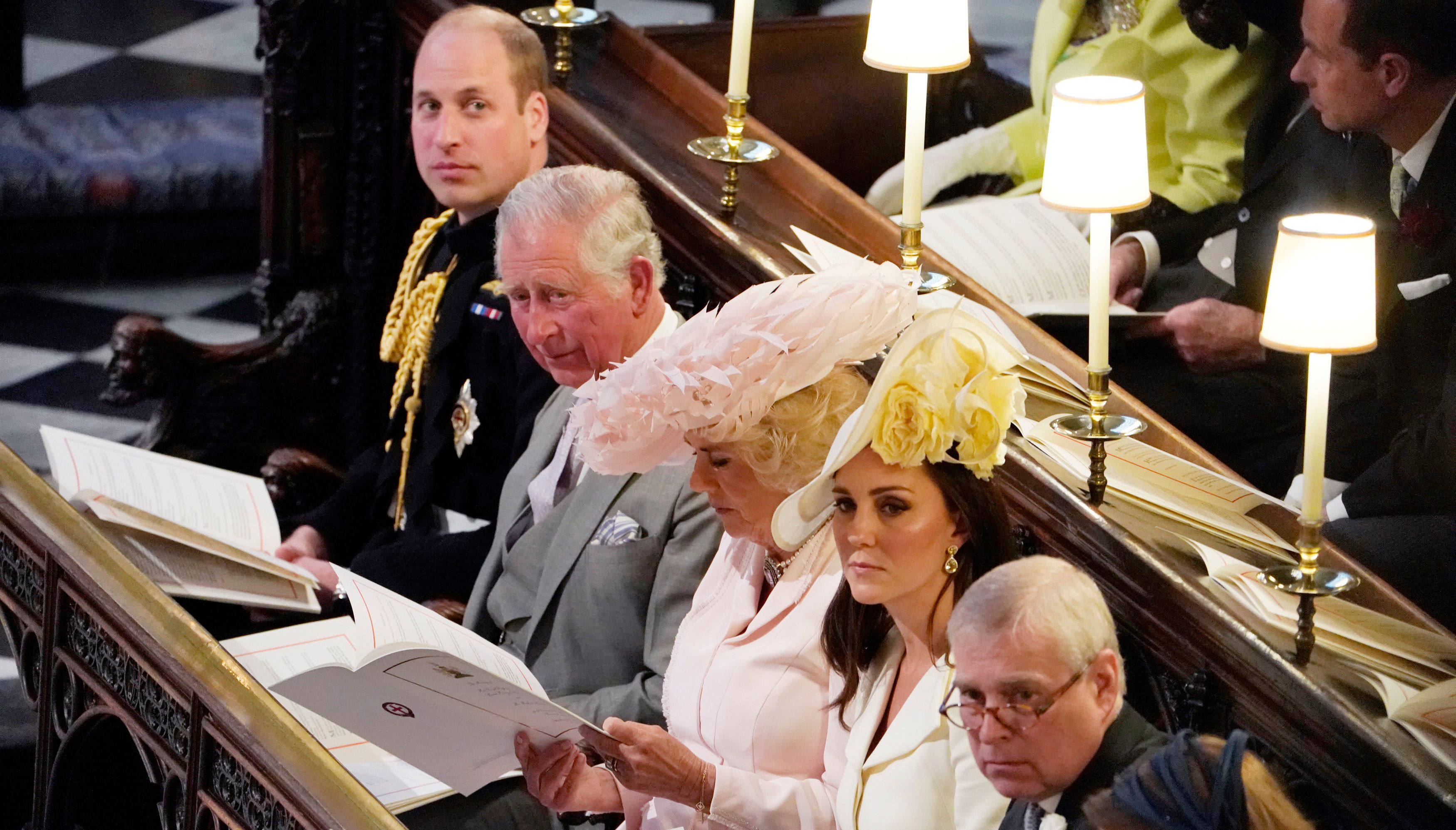 (Left to right) The Duke of Cambridge, the Prince of Wales, the Duchess of Cornwall, the Duchess of Cambridge, the Duke of York and Princess Beatrice sitting in St George's Chapel at Windsor Castle during the wedding of Prince Harry and Meghan Markle.