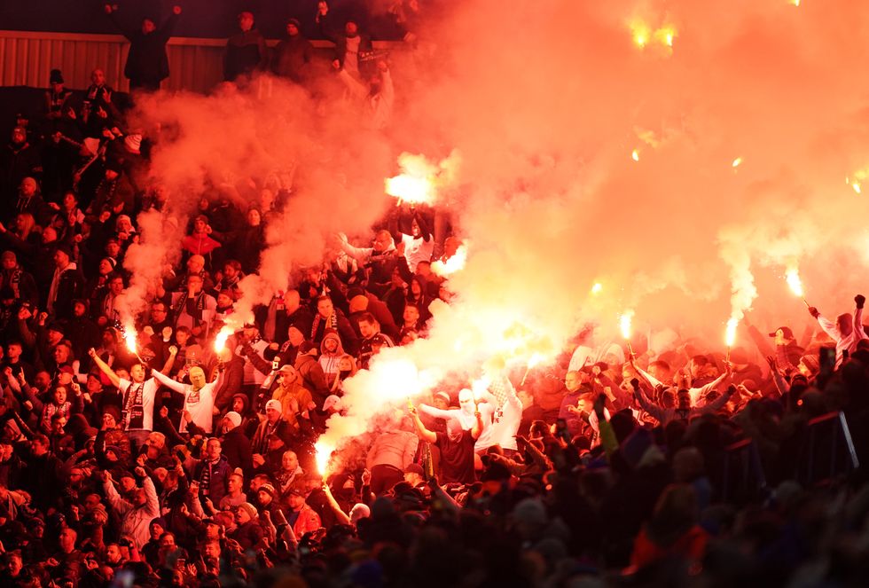 Legia Warsaw fans in the stands set off flares during the UEFA Europa League, Group C match at the King Power Stadium.